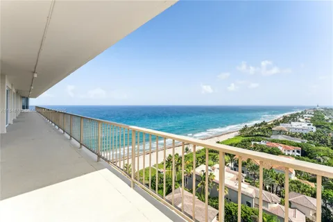a view of a balcony with ocean view