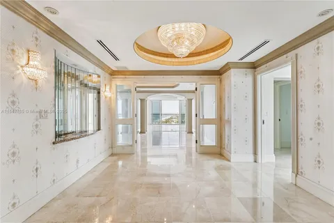 a view of an empty room and a window