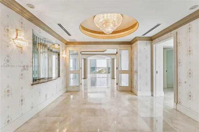 a view of an empty room and a window