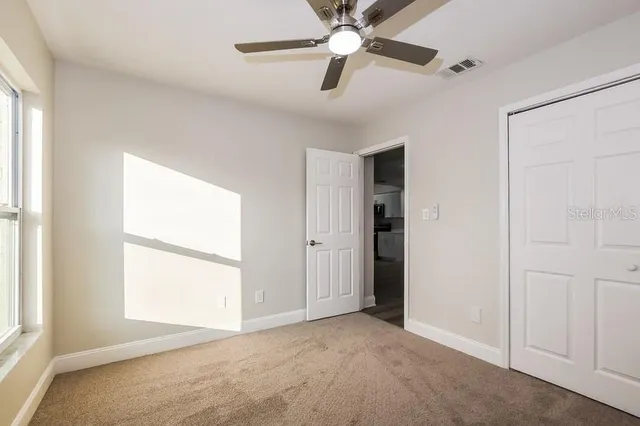 a view of an empty room with a window