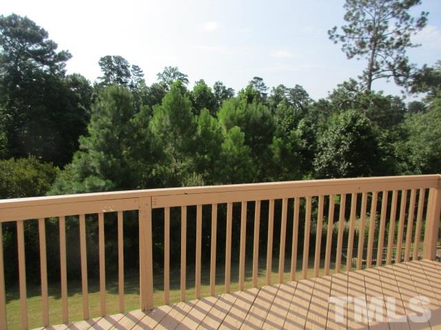7714 San Gabriel Street Raleigh, NC 27613 - Photo 16 of 25 a view of a wooden fence