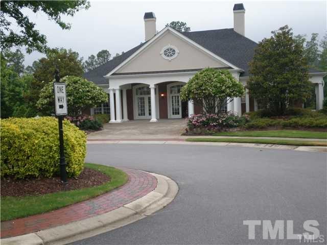 7714 San Gabriel Street Raleigh, NC 27613 - Photo 20 of 25 a front view of a house with a yard
