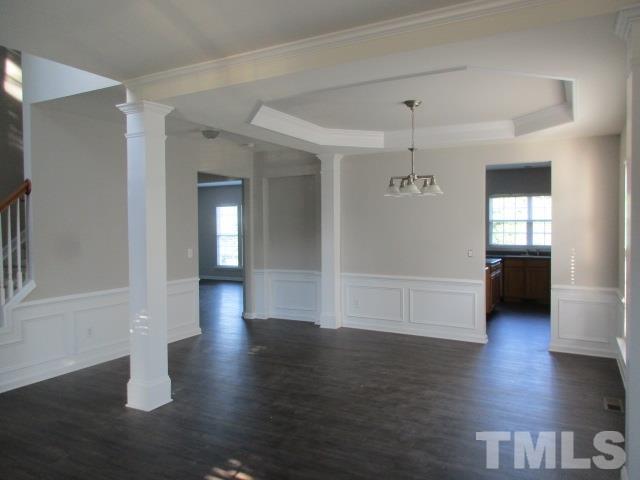 7714 San Gabriel Street Raleigh, NC 27613 - Photo 3 of 25 a view of a hallway with wooden floor and windows