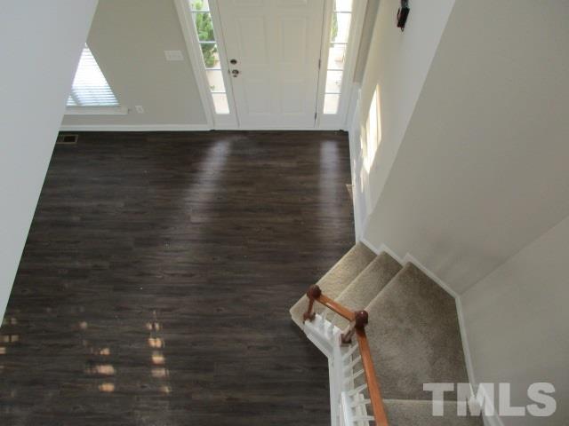 7714 San Gabriel Street Raleigh, NC 27613 - Photo 9 of 25 a view of hallway with wooden floor