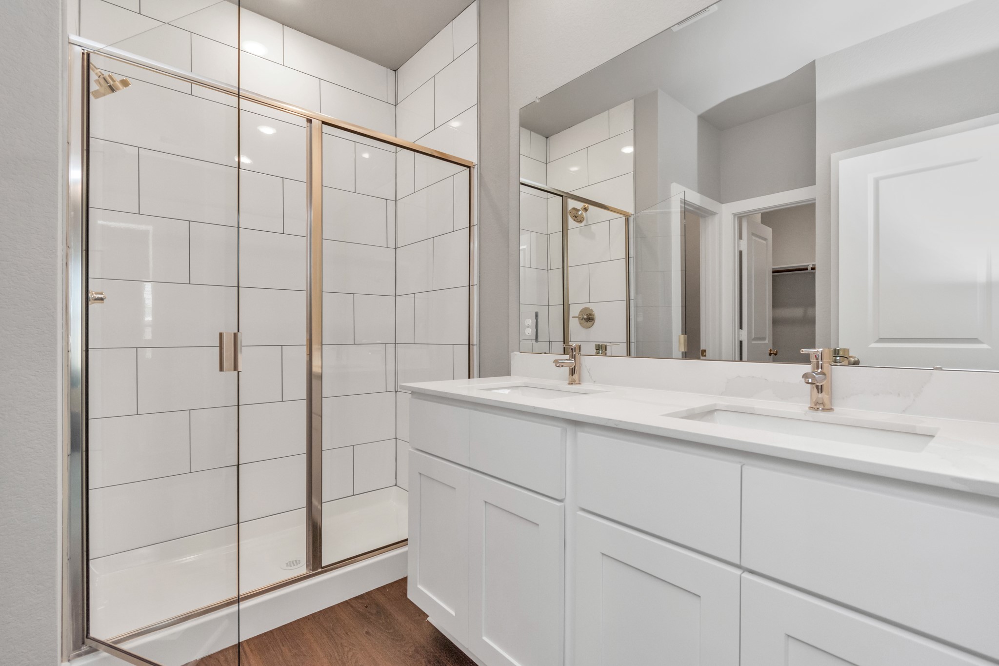 10638 Cascade Crk Drive Rosharon, TX 77583 - Photo 9 of 24 a bathroom with a double vanity sink and mirror
