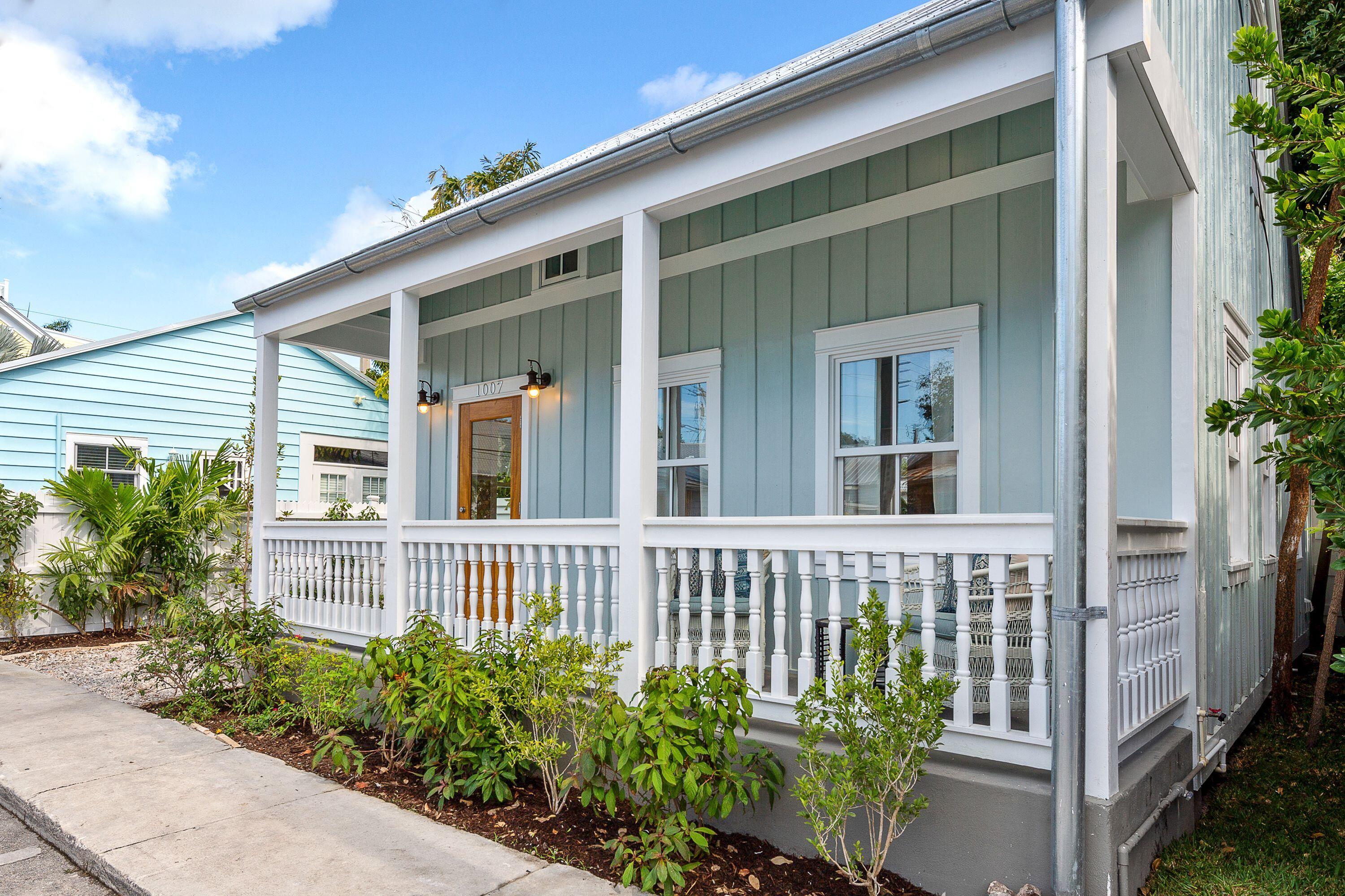 1007 Thomas Street Key West, FL 33040 - Photo 13 of 31 a front view of a house with a garden