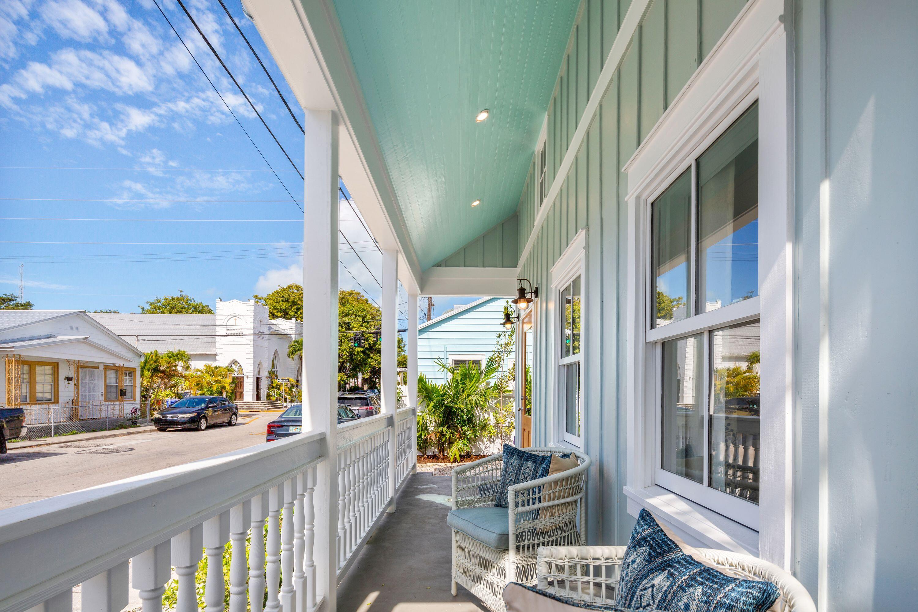 1007 Thomas Street Key West, FL 33040 - Photo 14 of 31 a view of an chairs and table in the balcony