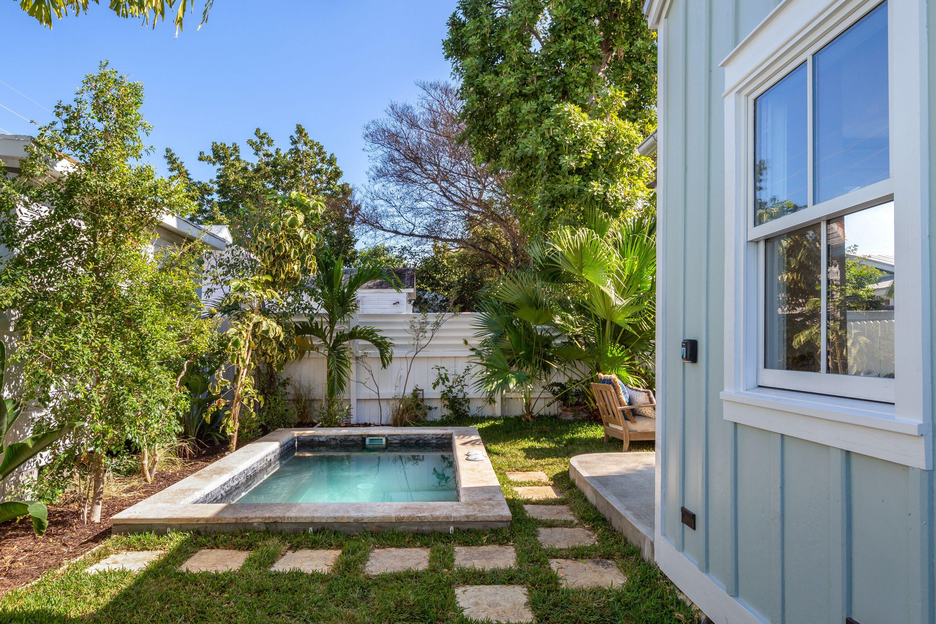 1007 Thomas Street Key West, FL 33040 - Photo 17 of 31 a view of a backyard with swimming pool