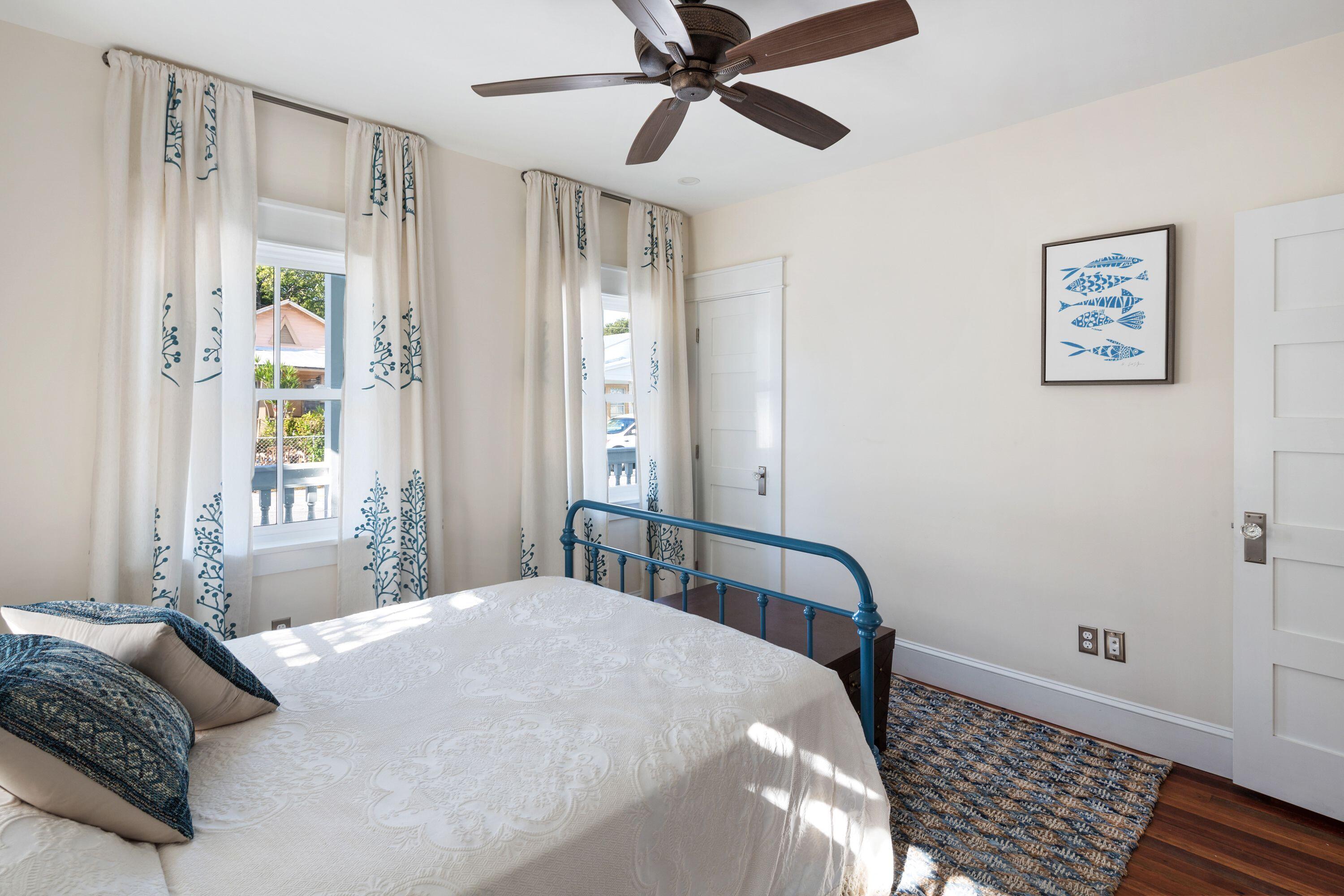 1007 Thomas Street Key West, FL 33040 - Photo 24 of 31 a bedroom with a bed and a window