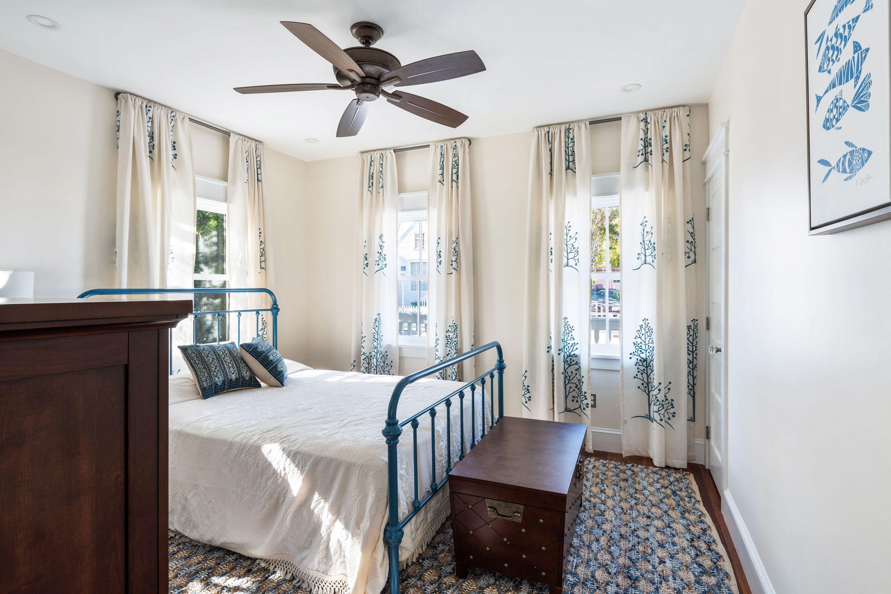 1007 Thomas Street Key West, FL 33040 - Photo 26 of 31 a bedroom with furniture and a window