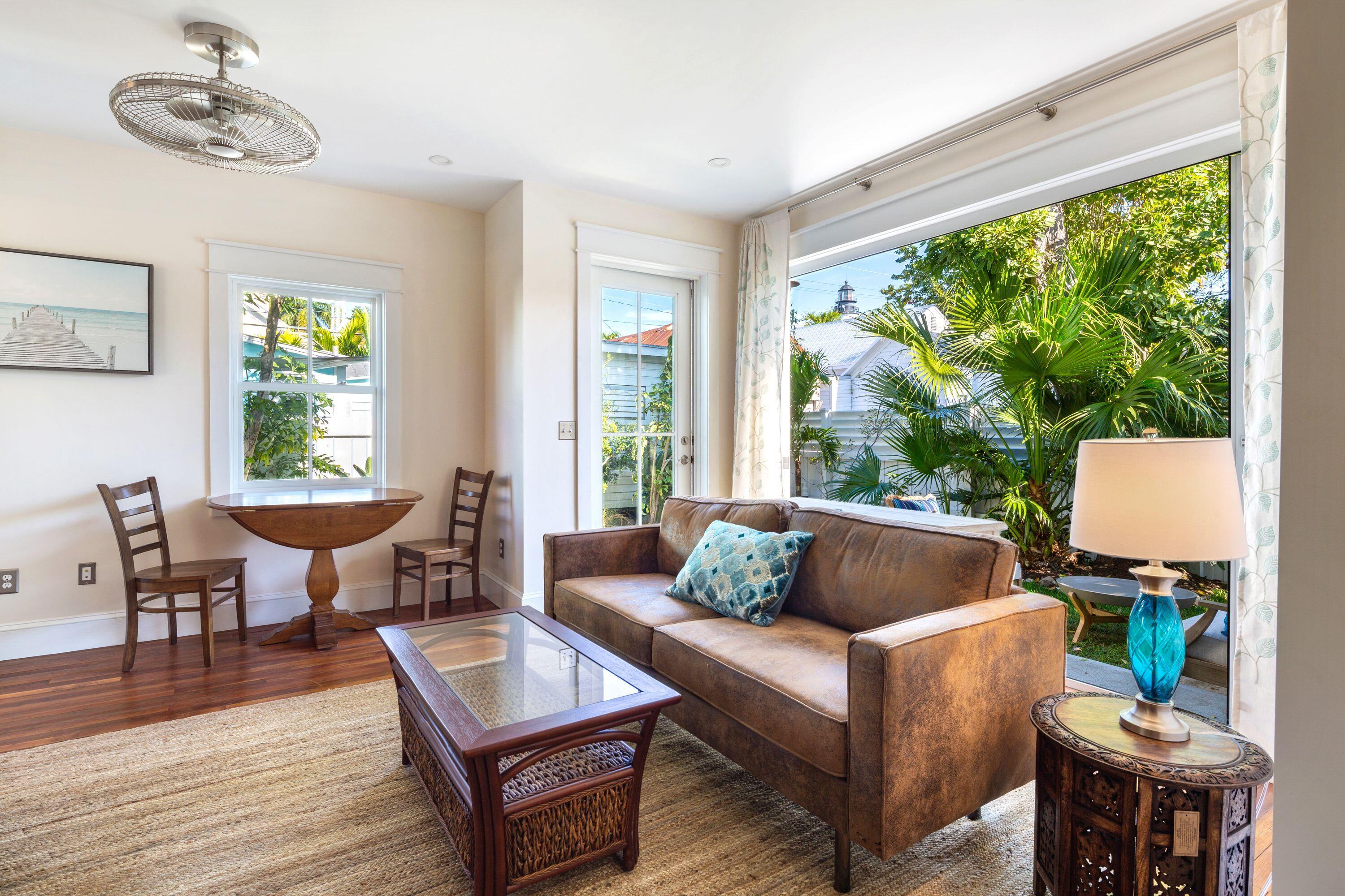 1007 Thomas Street Key West, FL 33040 - Photo 28 of 31 a living room with furniture and a window