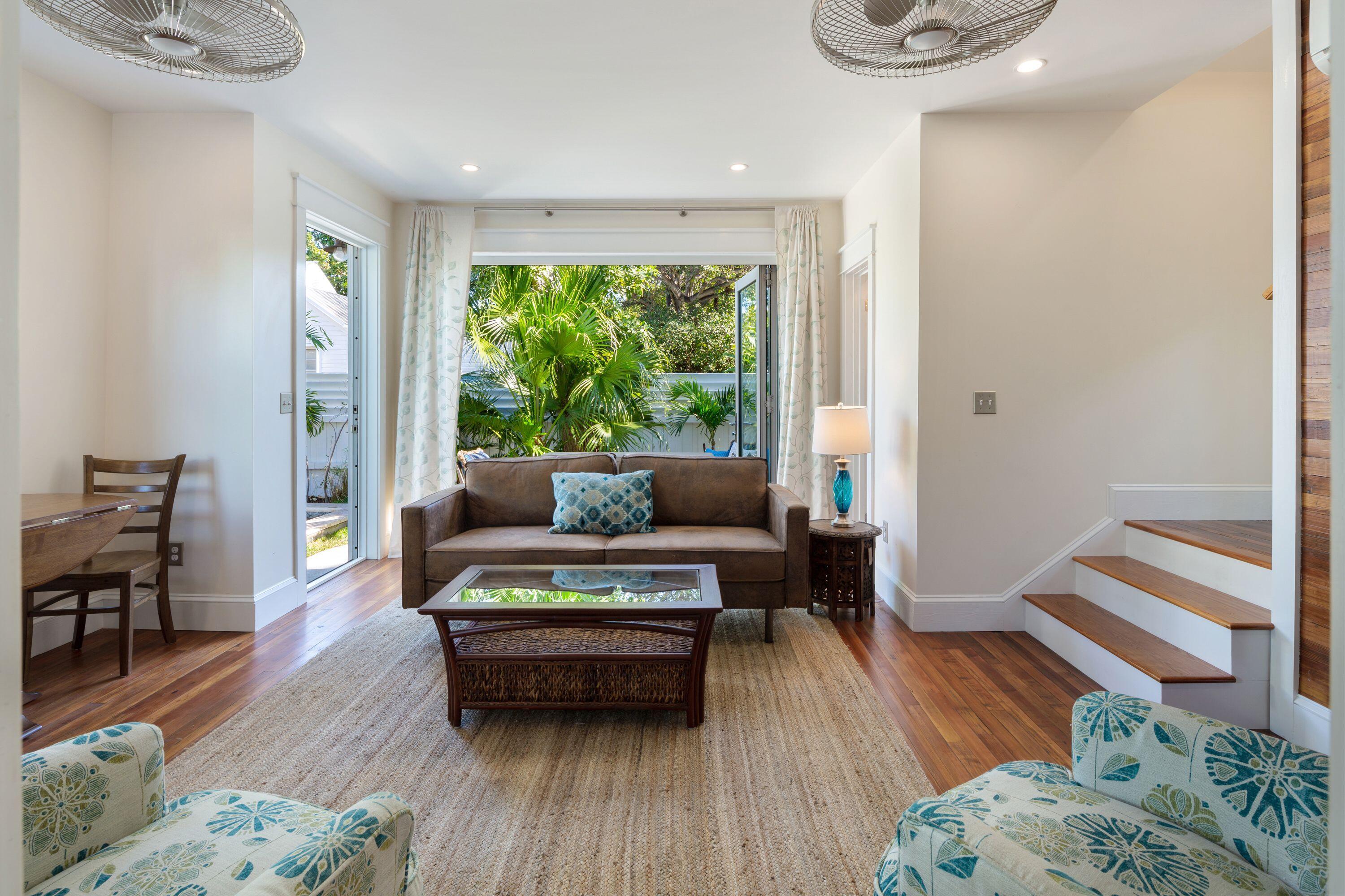 1007 Thomas Street Key West, FL 33040 - Photo 30 of 31 a living room with furniture and a wooden floor