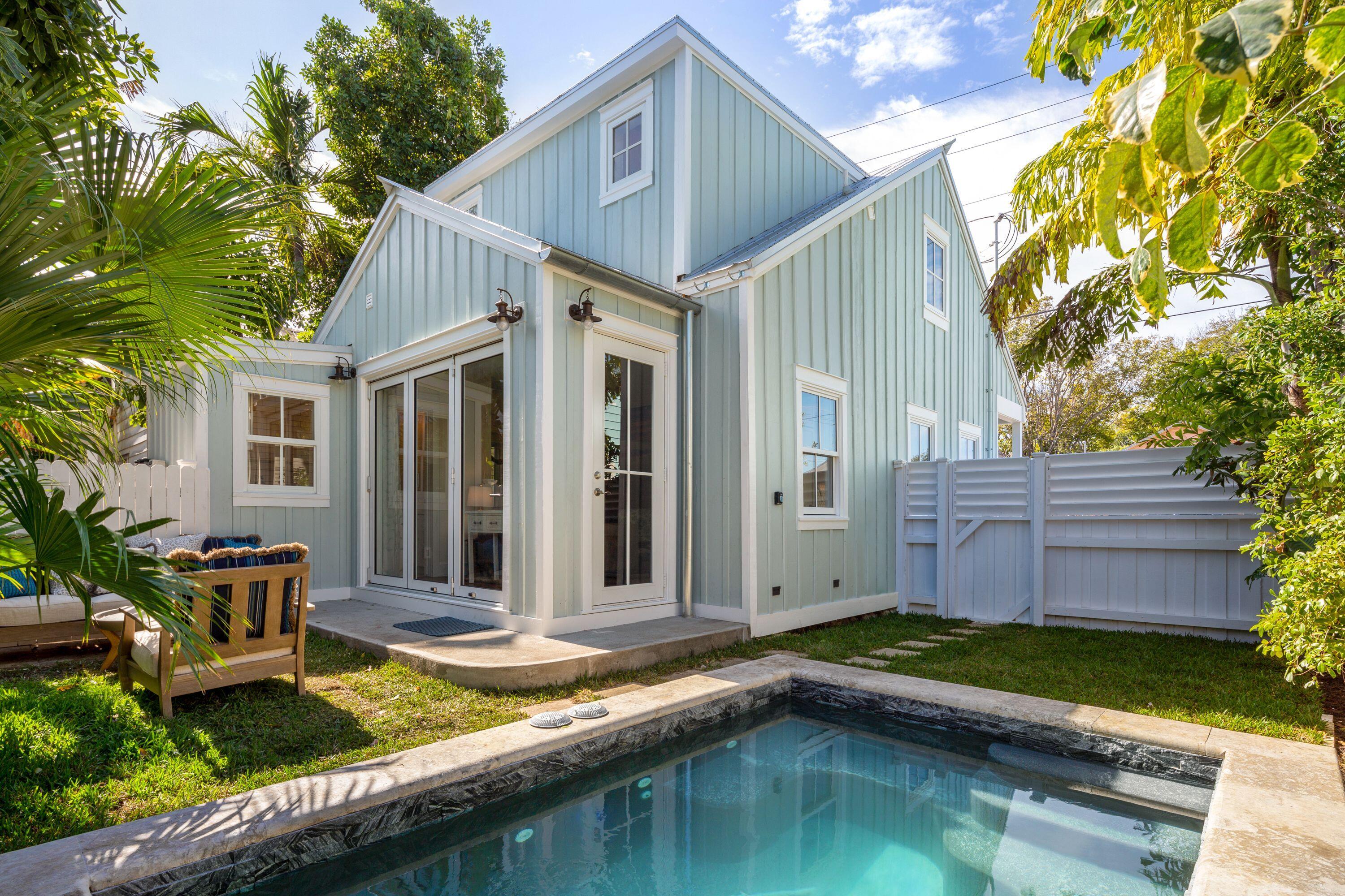 1007 Thomas Street Key West, FL 33040 - Photo 3 of 31 a view of a house with backyard swimming pool and sitting area