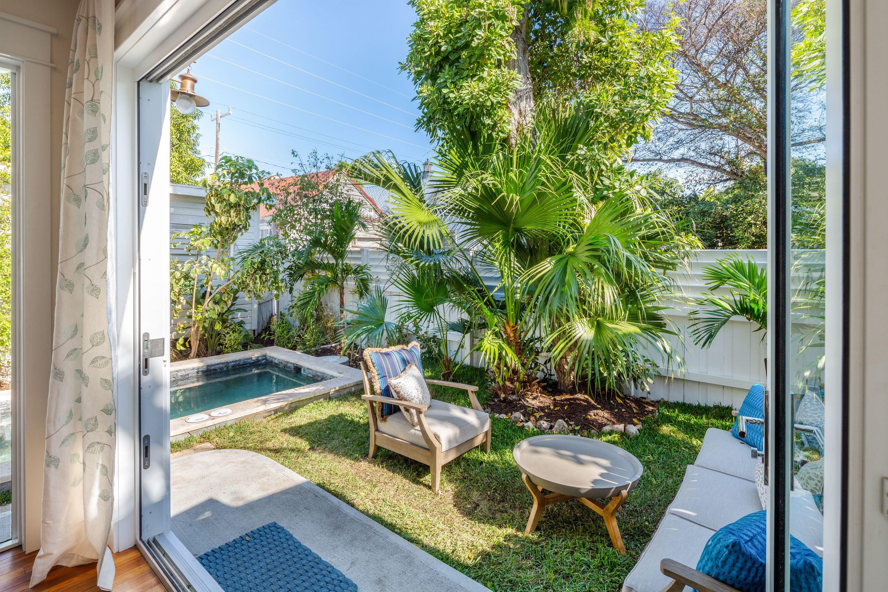 1007 Thomas Street Key West, FL 33040 - Photo 31 of 31 a view of backyard with swimming pool and outdoor seating