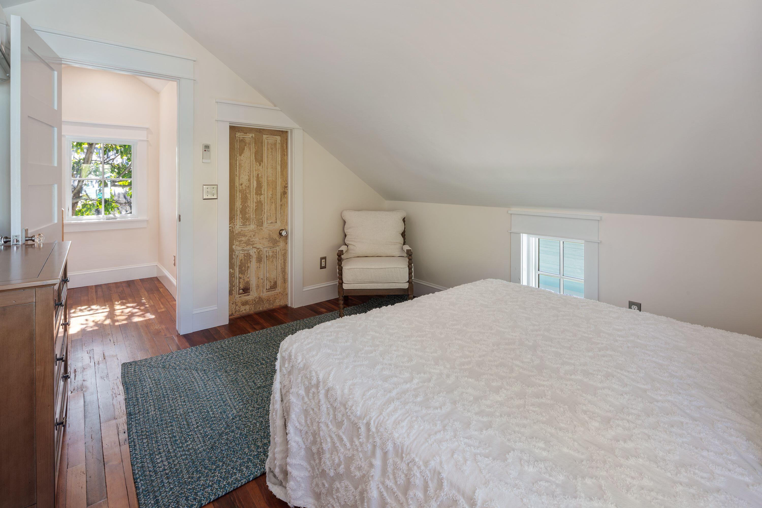 1007 Thomas Street Key West, FL 33040 - Photo 6 of 31 a bedroom with a bed and window