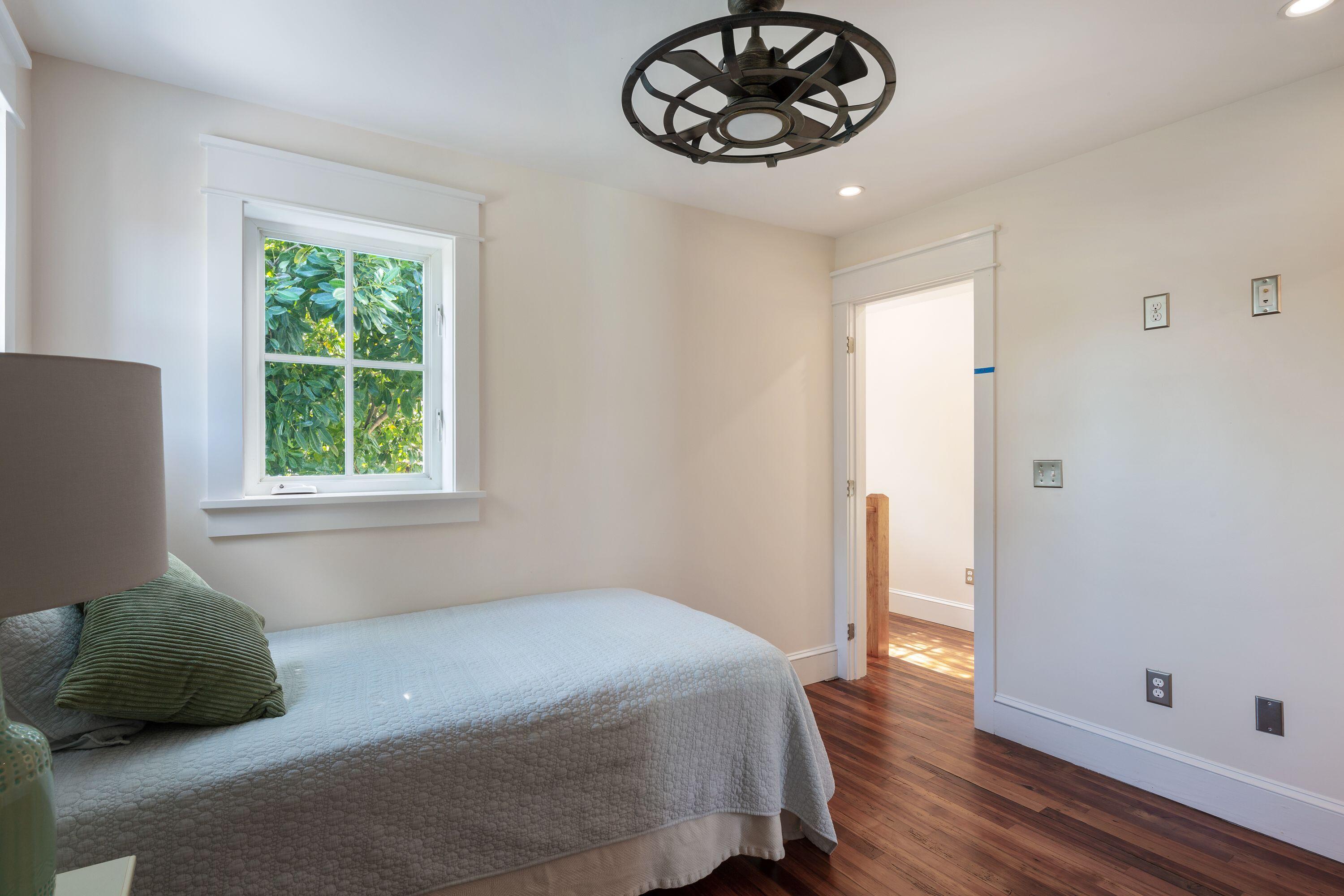 1007 Thomas Street Key West, FL 33040 - Photo 9 of 31 a bedroom with a bed and a window