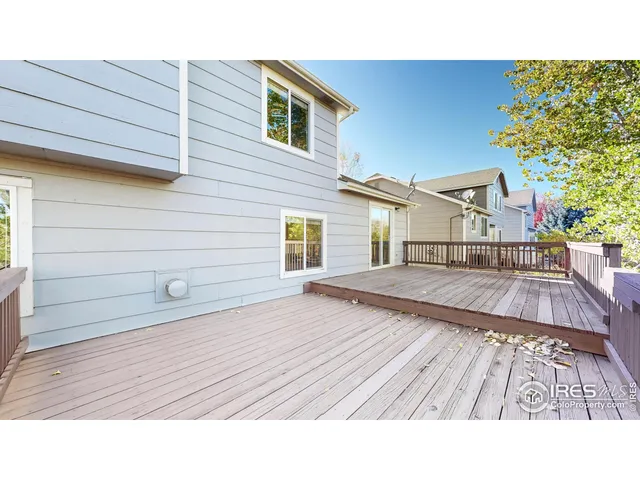 a view of a balcony with wooden floor