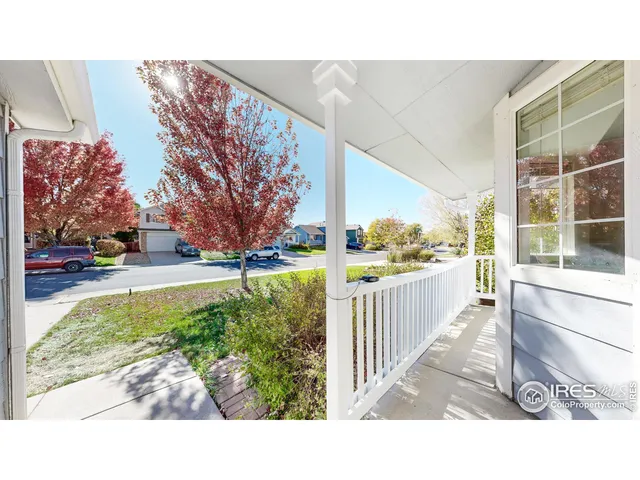 a picture of a bench in front of a building