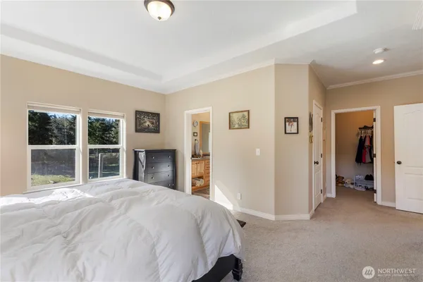 a bedroom with a bed and a closet