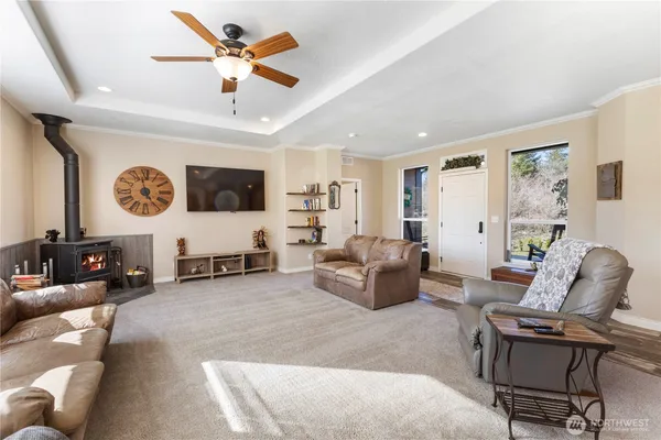 a kitchen with stainless steel appliances granite countertop a sink a stove a refrigerator and island