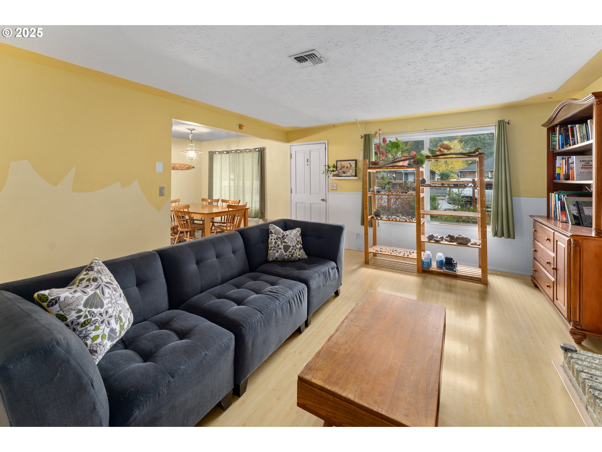 436 West M Street Springfield, OR 97477 - Photo 13 of 22 a living room with furniture and a flat screen tv
