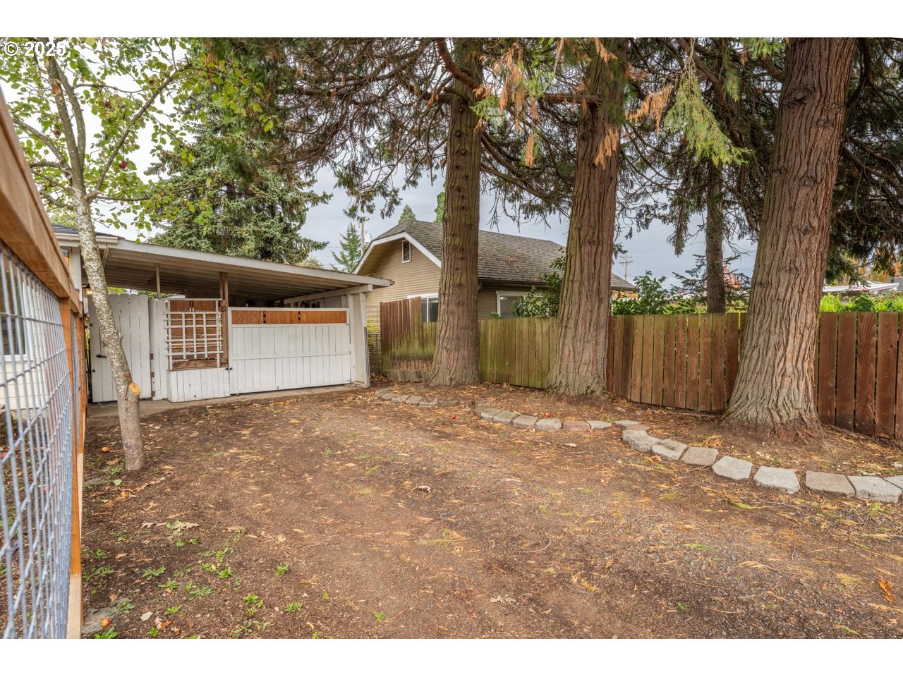 436 West M Street Springfield, OR 97477 - Photo 4 of 22 a backyard of a house with trees and outdoor space