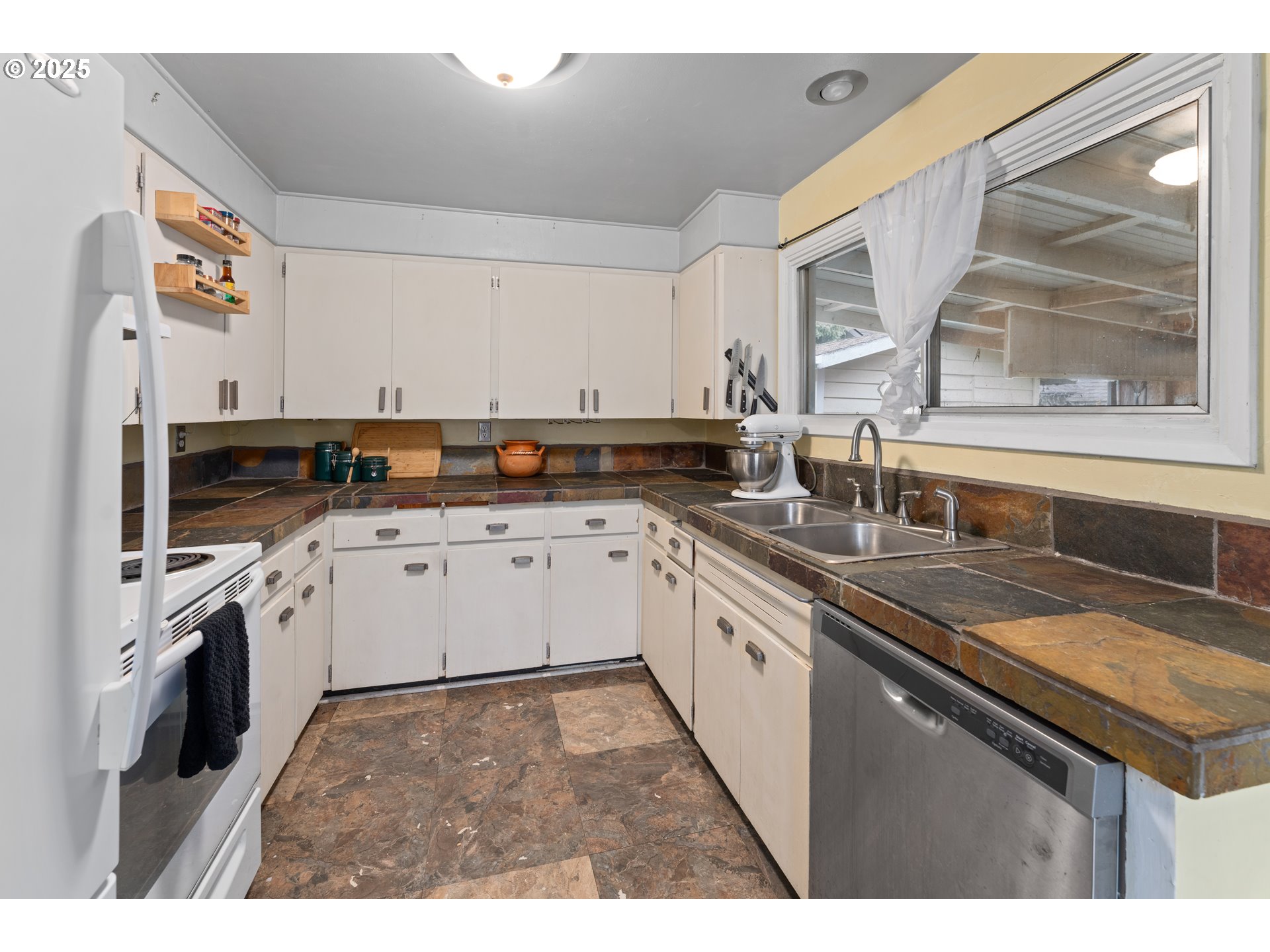 436 West M Street Springfield, OR 97477 - Photo 6 of 22 a kitchen with granite countertop a sink stainless steel appliances and cabinets