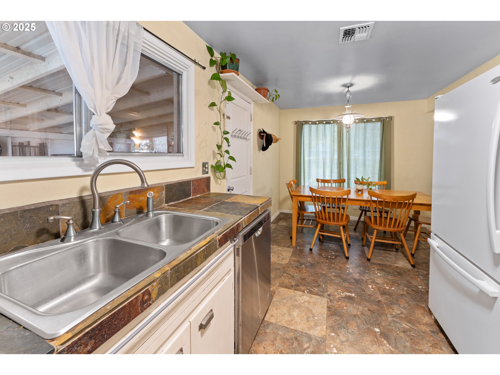 436 West M Street Springfield, OR 97477 - Photo 8 of 22 a kitchen with a sink and chairs