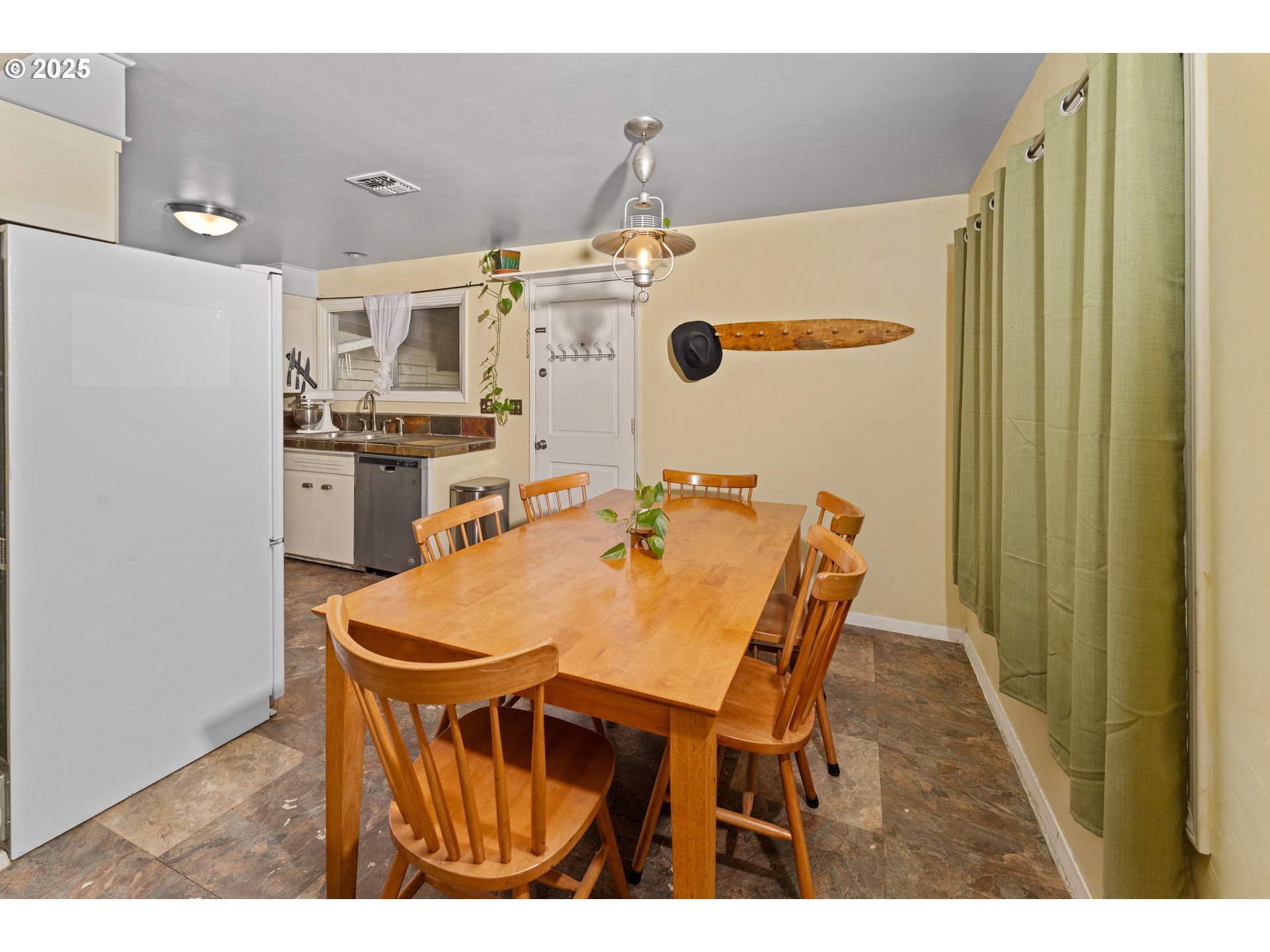 436 West M Street Springfield, OR 97477 - Photo 9 of 22 a dining room with stainless steel appliances a table and chairs