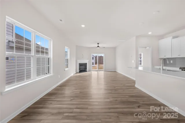 a kitchen with kitchen island a refrigerator sink and stove