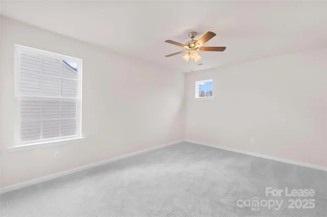 a view of a house with a yard and garage