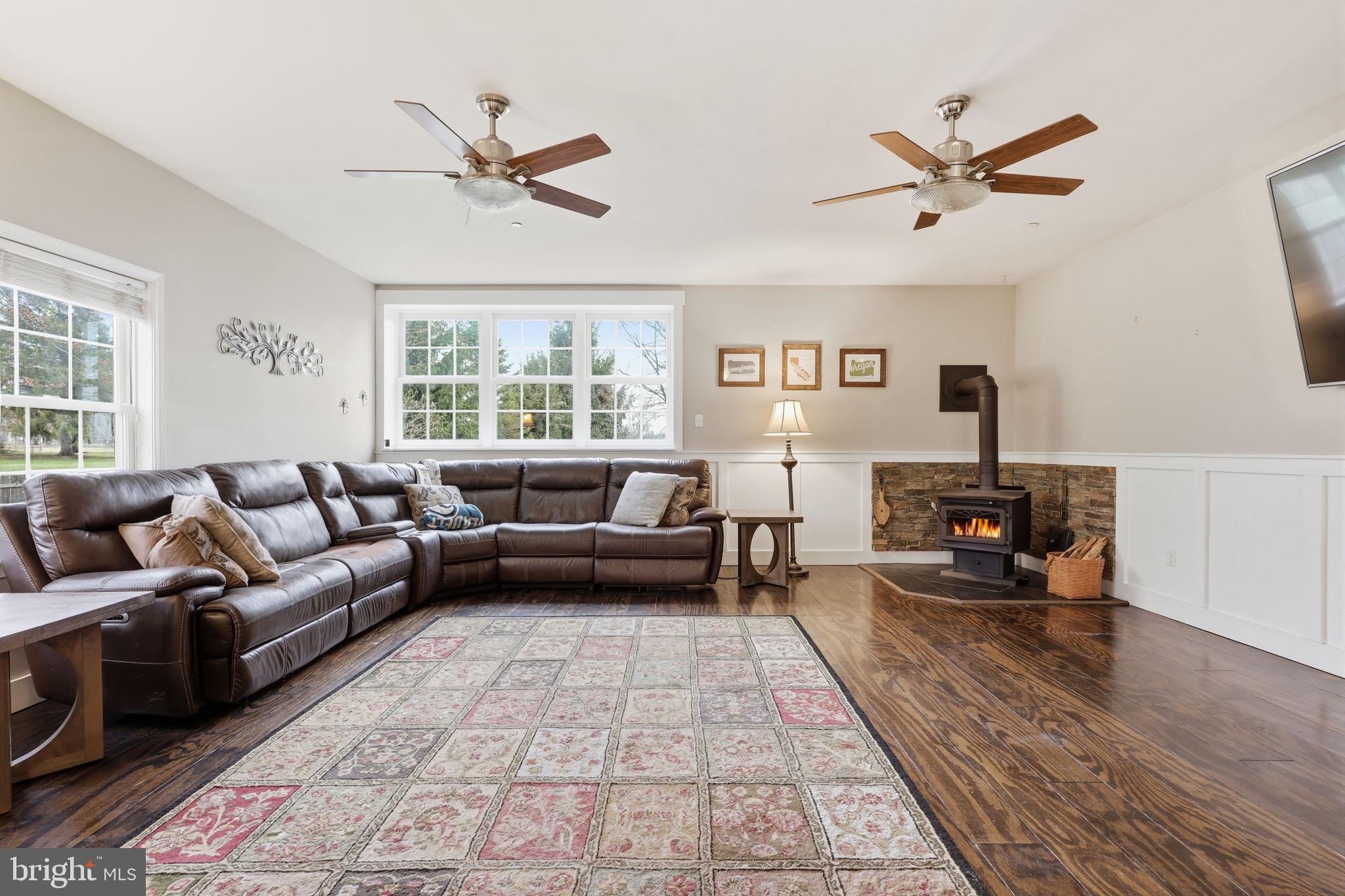 3852 Dark Hollow Road Furlong, PA 18925 - Photo 11 of 52 a living room with furniture and a fireplace