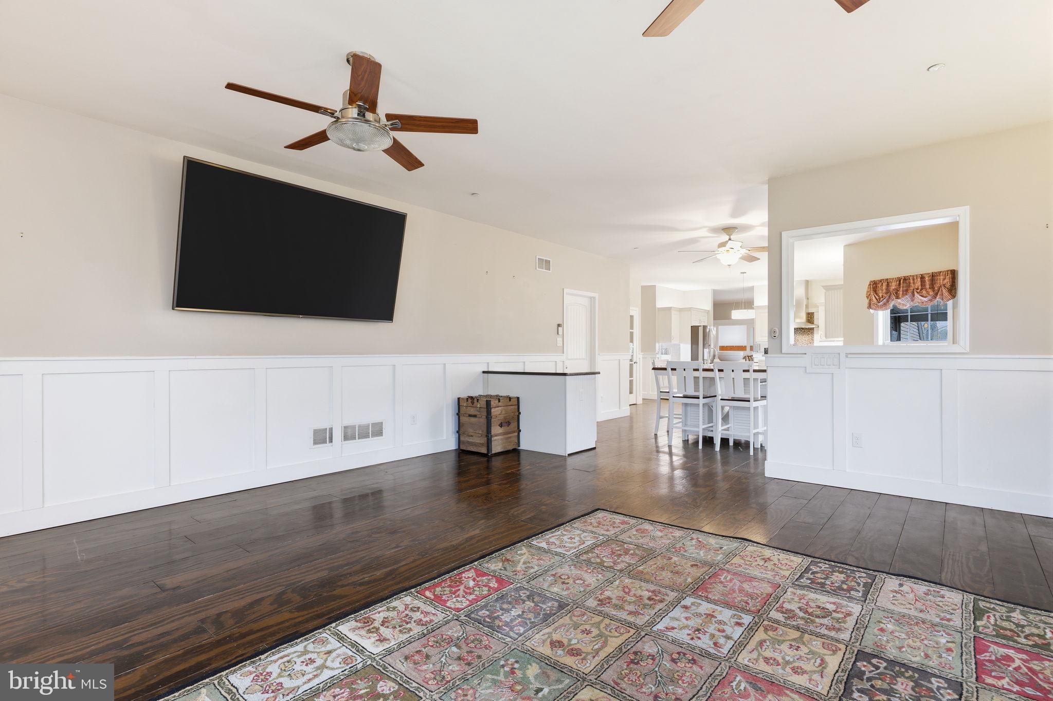 3852 Dark Hollow Road Furlong, PA 18925 - Photo 12 of 52 a living room with couches and a flat screen tv