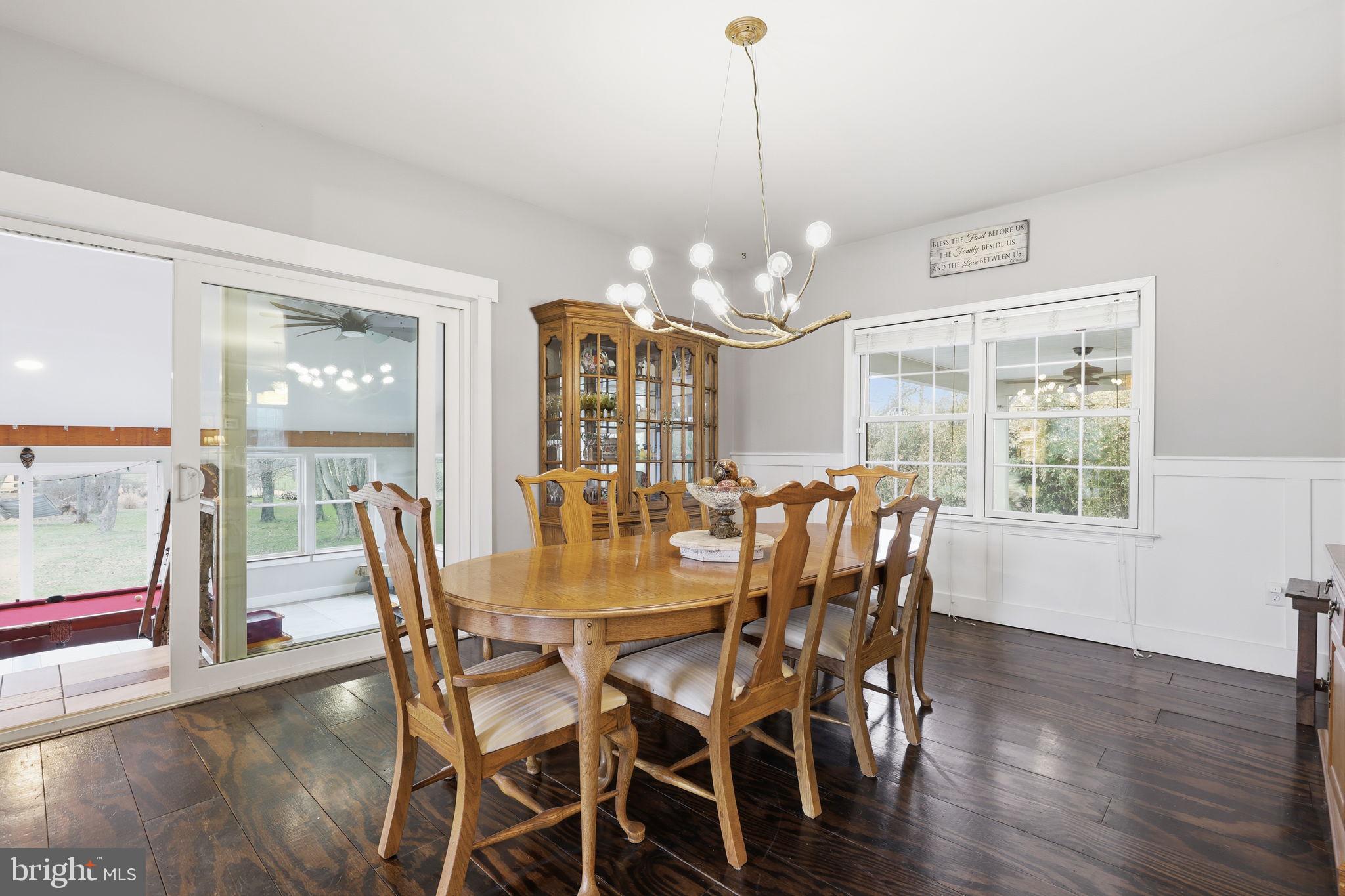 3852 Dark Hollow Road Furlong, PA 18925 - Photo 13 of 52 a view of a dining room with furniture wooden floor and chandelier
