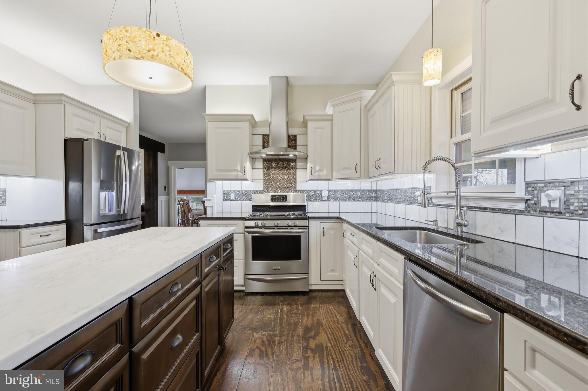 3852 Dark Hollow Road Furlong, PA 18925 - Photo 16 of 52 a kitchen with a sink stove and refrigerator