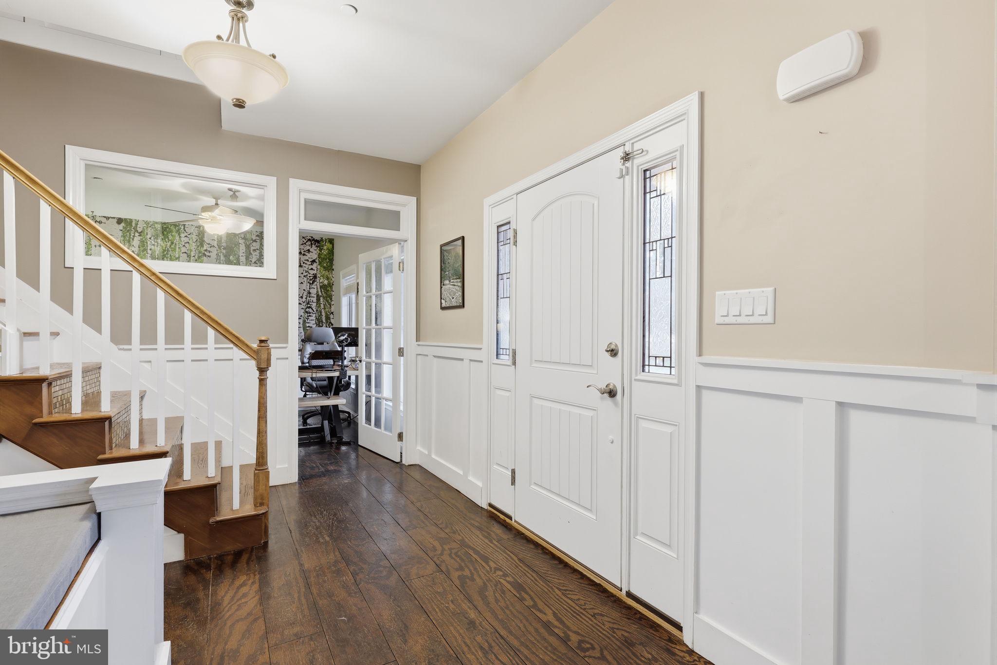 3852 Dark Hollow Road Furlong, PA 18925 - Photo 2 of 52 a view of entryway with wooden floor and stairs