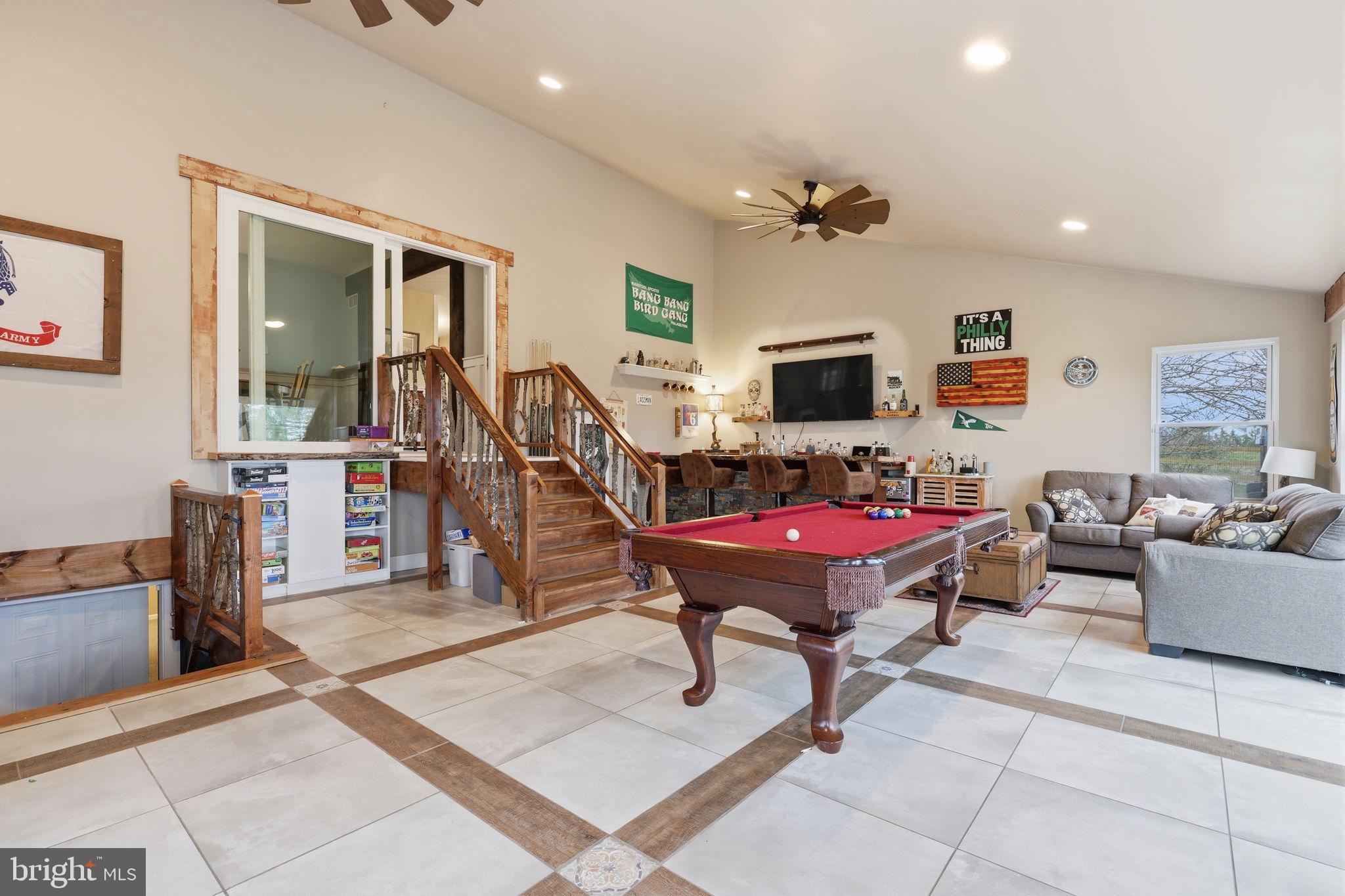 3852 Dark Hollow Road Furlong, PA 18925 - Photo 22 of 52 a living room with furniture a piano and a flat screen tv