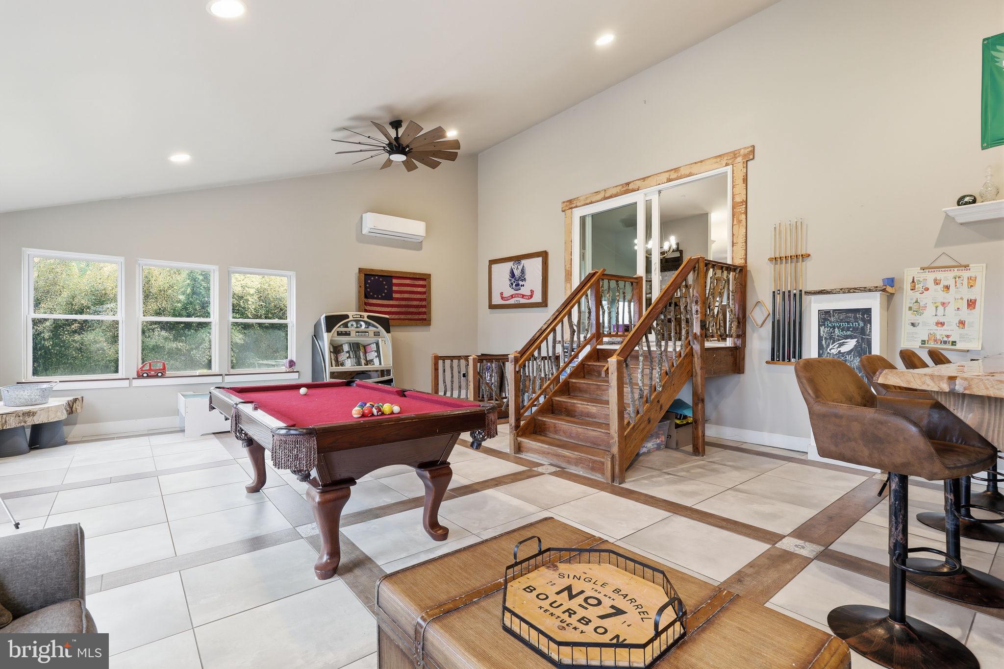 3852 Dark Hollow Road Furlong, PA 18925 - Photo 23 of 52 a view of a room with furniture wooden floor and a rug