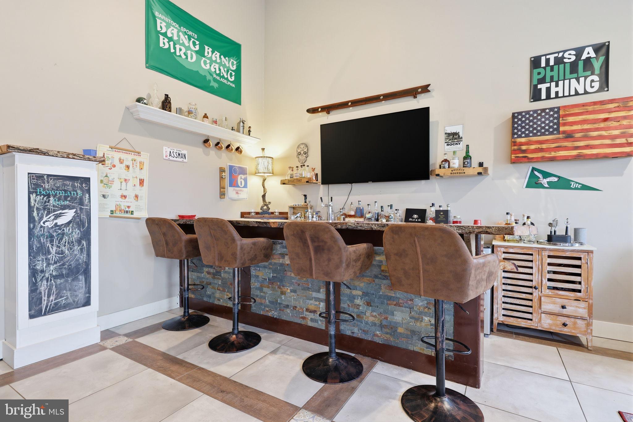3852 Dark Hollow Road Furlong, PA 18925 - Photo 25 of 52 a living room with furniture and a flat screen tv