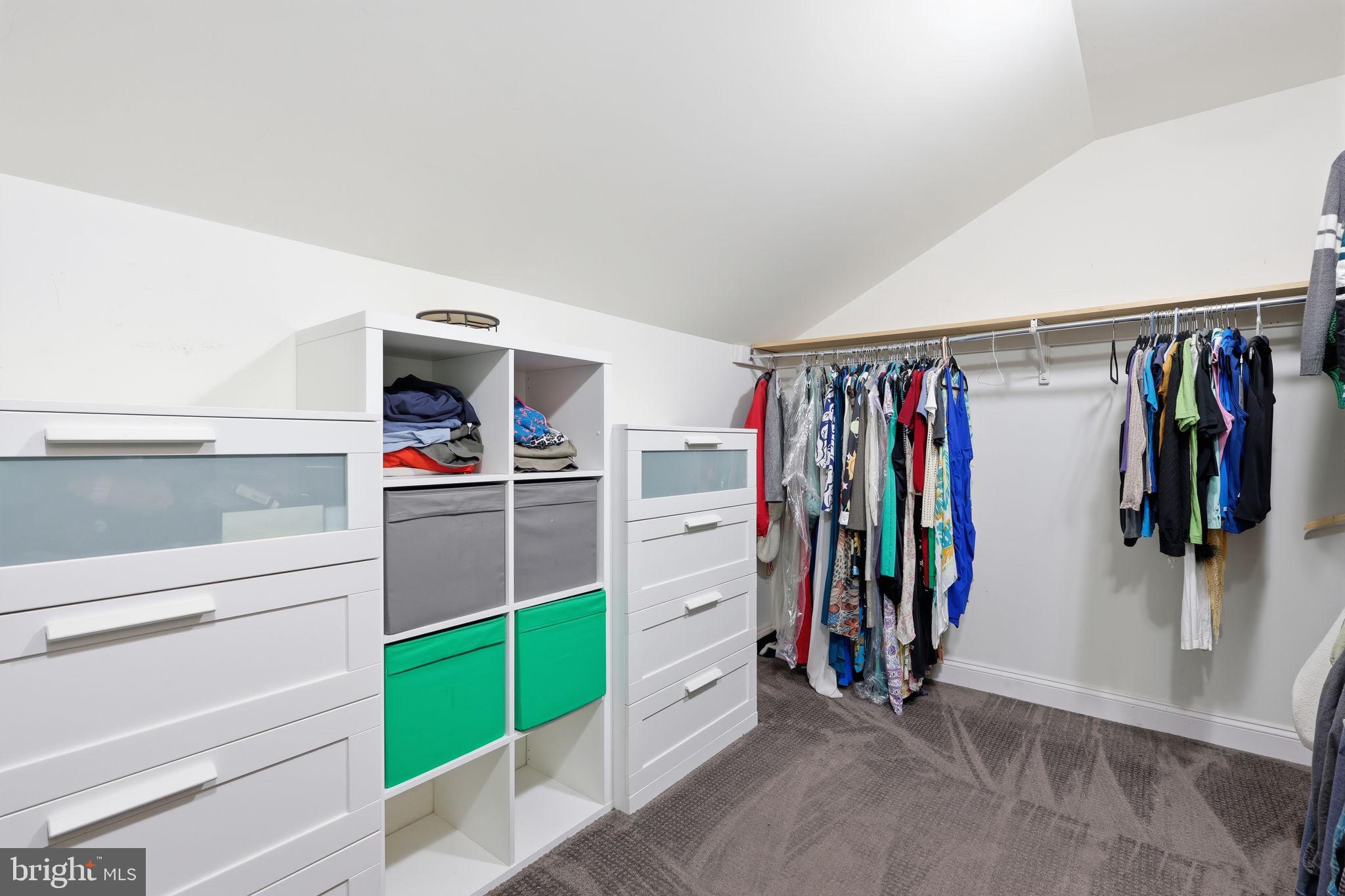 3852 Dark Hollow Road Furlong, PA 18925 - Photo 40 of 52 a view of walk in closet with clothes and shoes