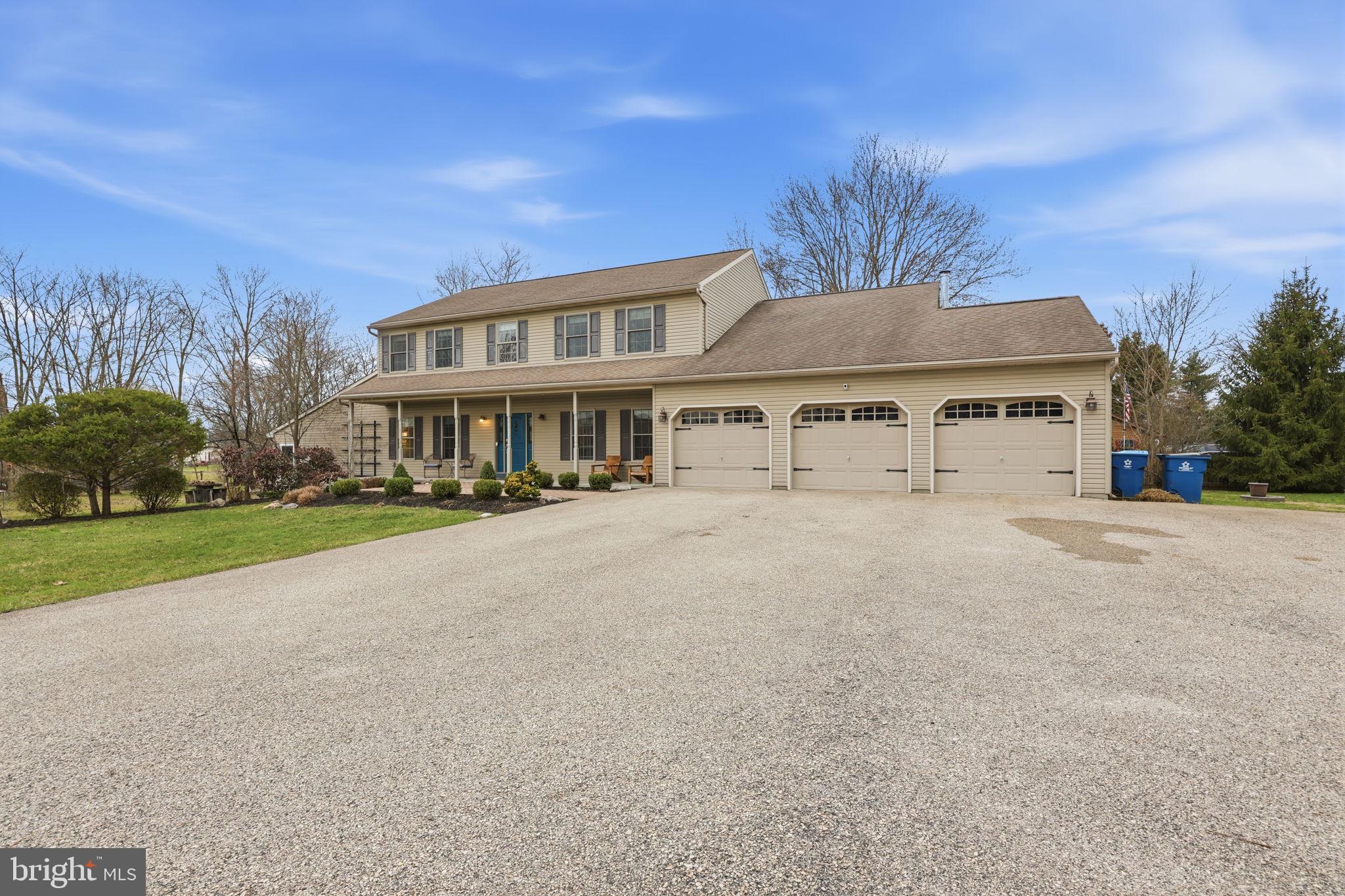 3852 Dark Hollow Road Furlong, PA 18925 - Photo 52 of 52 a front view of a house with a yard