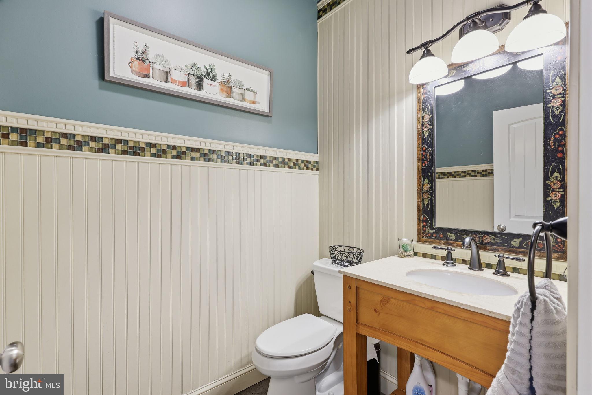 3852 Dark Hollow Road Furlong, PA 18925 - Photo 7 of 52 a bathroom with a sink a toilet and a mirror