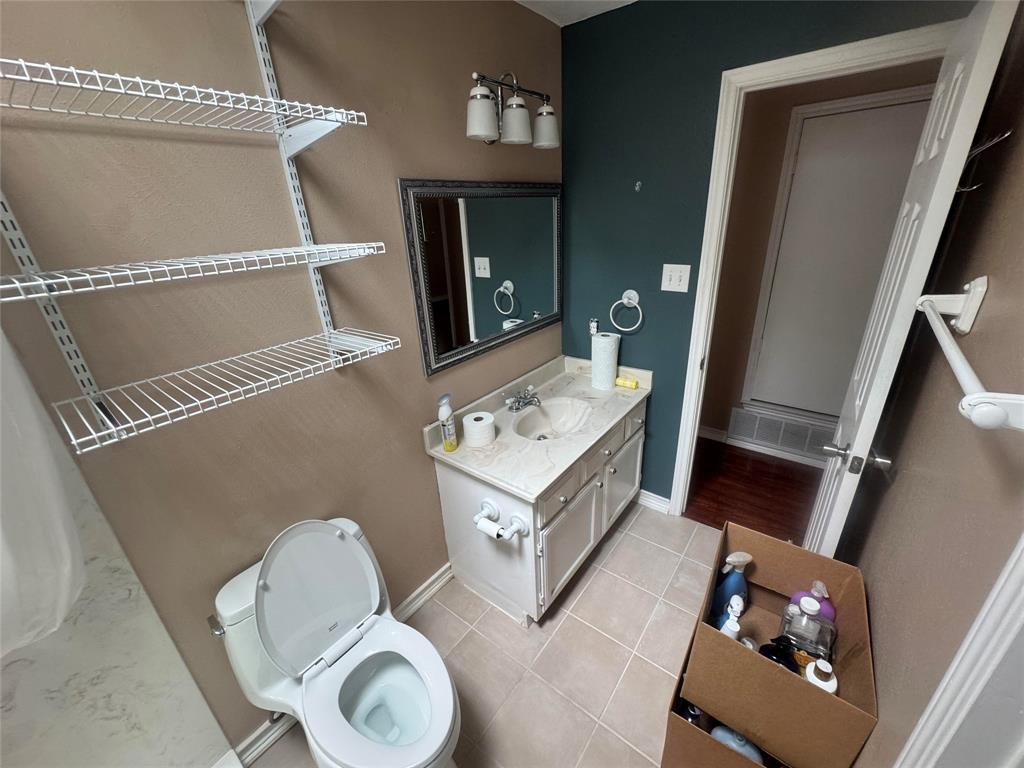 4649 Misty Ridge Drive Fort Worth, TX 76137 - Photo 7 of 25 a view of living room with washing machine and mirror