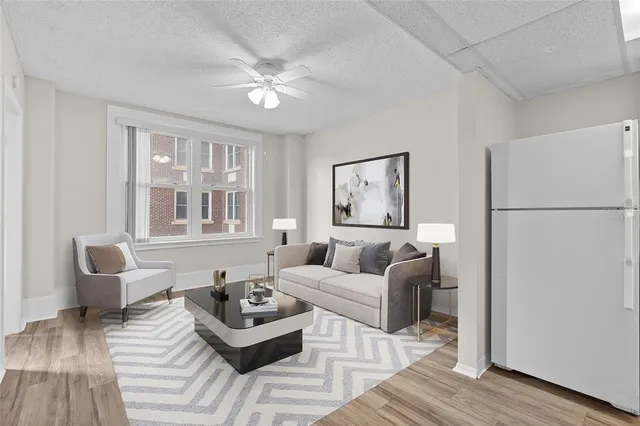 a living room with furniture and a table