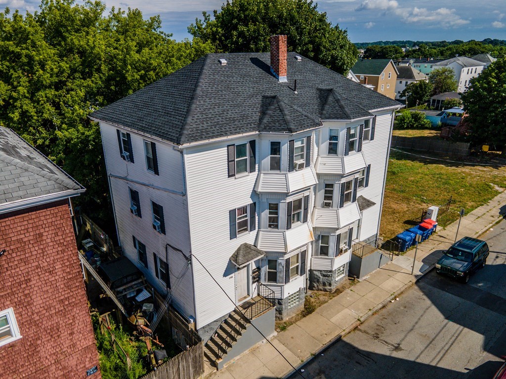 130 Baker Street Fall River, MA 02721 - Photo 1 of 21 an aerial view of a house with yard table and chairs