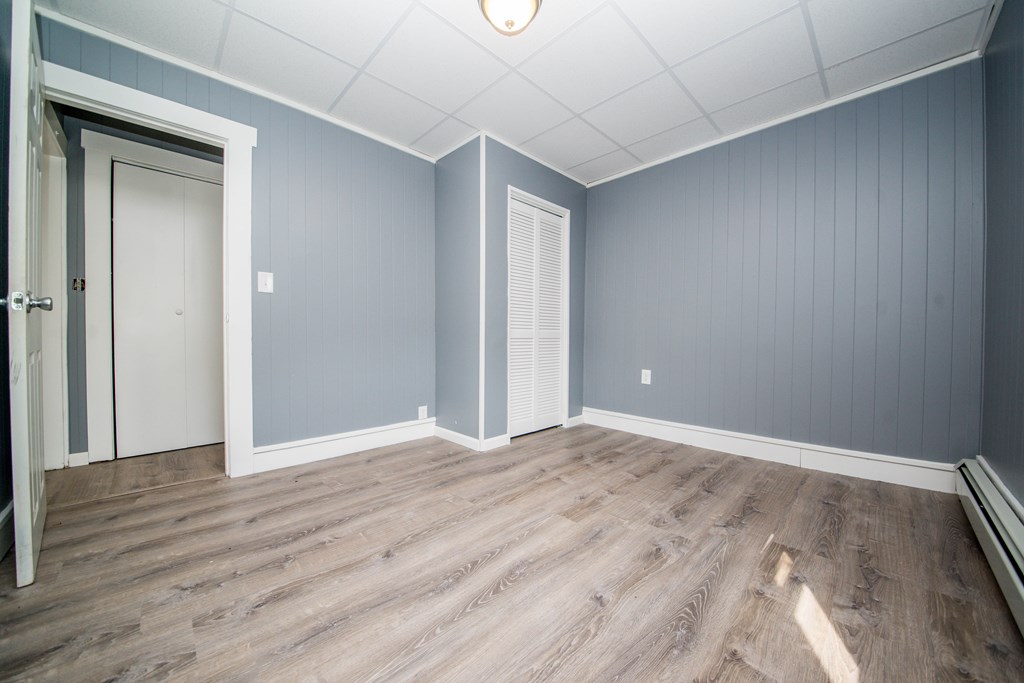 130 Baker Street Fall River, MA 02721 - Photo 15 of 21 a view of an empty room with wooden floor and a window
