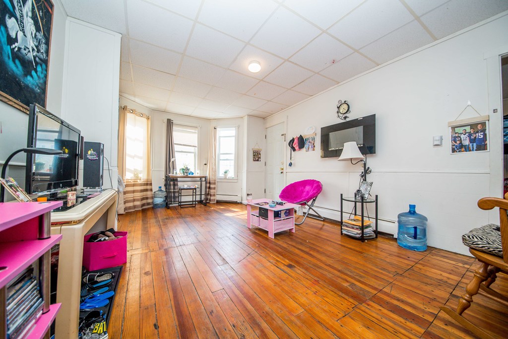 130 Baker Street Fall River, MA 02721 - Photo 19 of 21 a bedroom with furniture and a wooden floor