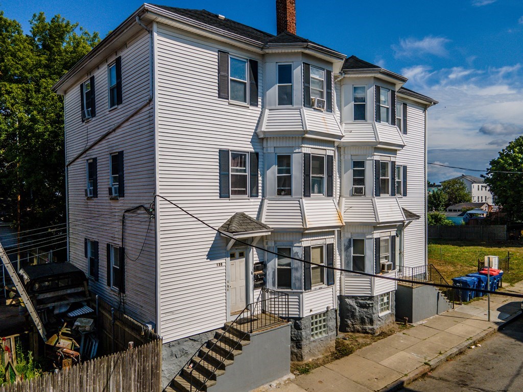 130 Baker Street Fall River, MA 02721 - Photo 2 of 21 a front view of a house with a yard