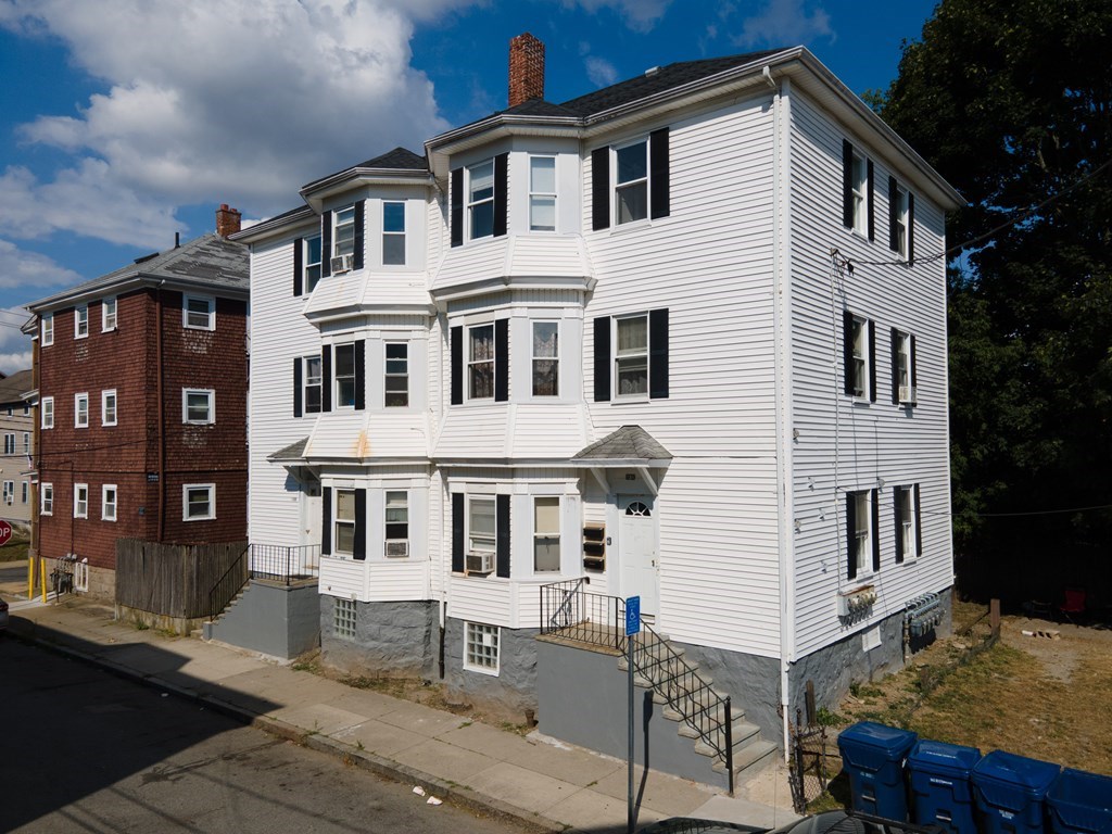 130 Baker Street Fall River, MA 02721 - Photo 3 of 21 a front view of a house with a yard