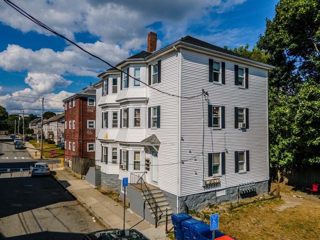 130 Baker Street Fall River, MA 02721 - Photo 4 of 21 a front view of a house with a yard